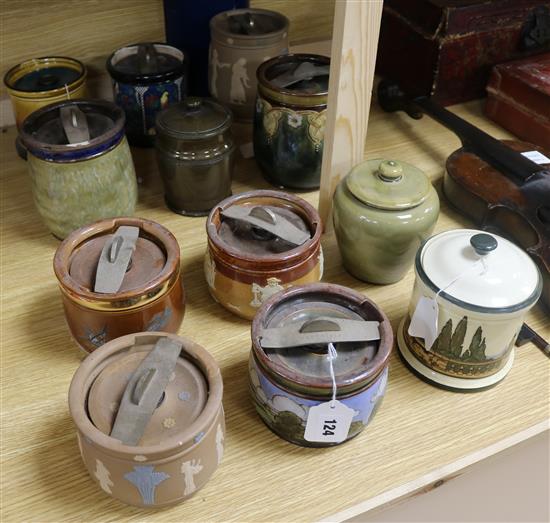 Twelve Doulton tobacco jars and covers, various designs